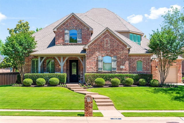 913 Bristlewood Dr, Mckinney, TX 75072 - traditional-style home featuring roof with shingles, brick siding, and a garage