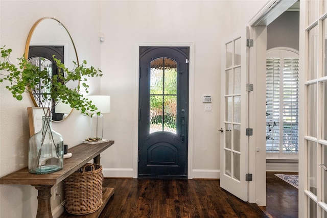 913 Bristlewood Dr, Mckinney, TX 75072 - foyer entrance featuring french doors, dark wood finished floors, and baseboards