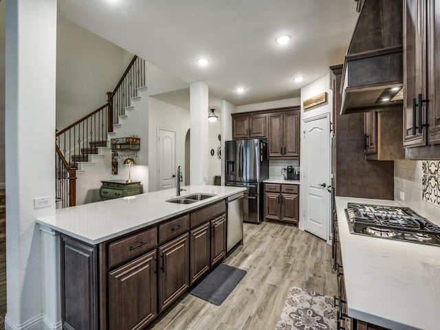 5216 Troupe Rd, Mckinney, TX 75071 - kitchen with a sink, stainless steel appliances, custom exhaust hood, light countertops, and recessed lighting