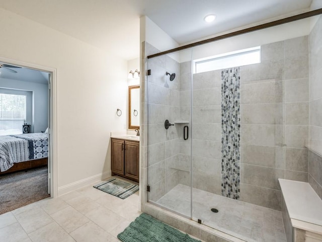 5216 Troupe Rd, Mckinney, TX 75071 - ensuite bathroom with vanity, a shower stall, baseboards, tile patterned floors, and a ceiling fan
