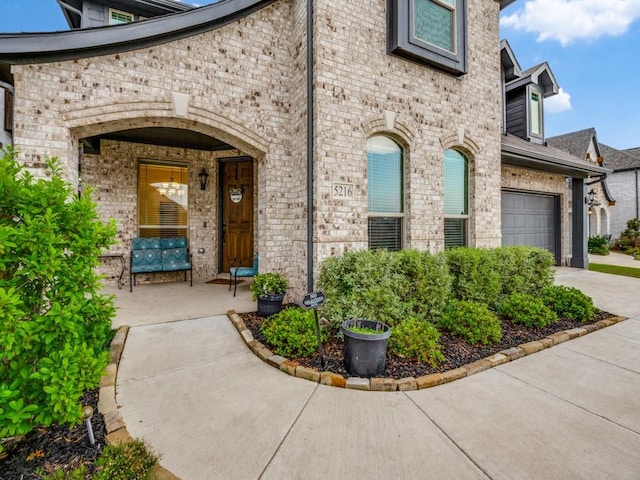 5216 Troupe Rd, Mckinney, TX 75071 - property entrance featuring brick siding and concrete driveway