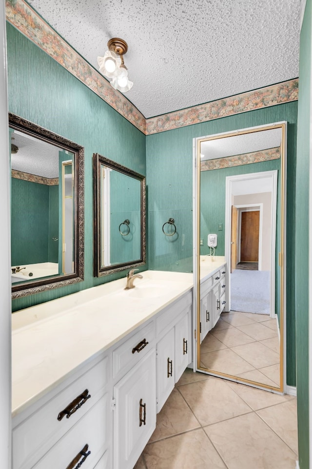 4509 Castle Combe Pl, North Richland Hills, TX 76180 - full bathroom featuring wallpapered walls, a textured ceiling, vanity, and tile patterned flooring