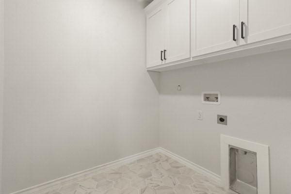 304 Pearl Harbor St, Tool, TX 75143 - washroom featuring cabinet space, hookup for an electric dryer, washer hookup, and baseboards