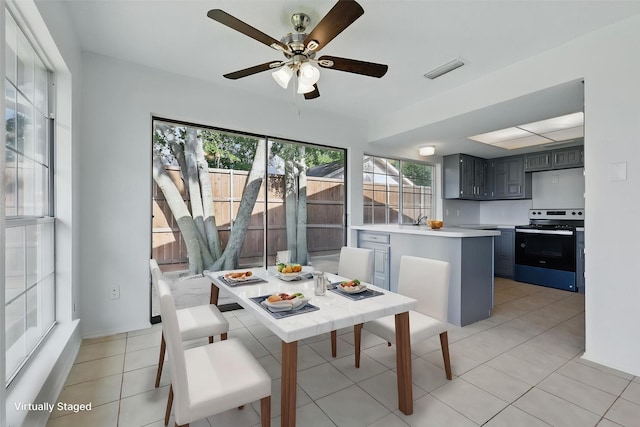 1713 Arvada Dr, Richardson, TX 75081 - dining area with ceiling fan and light tile patterned flooring