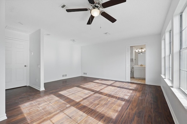 1713 Arvada Dr, Richardson, TX 75081 - spare room with wood finished floors, ceiling fan, a chandelier, and baseboards