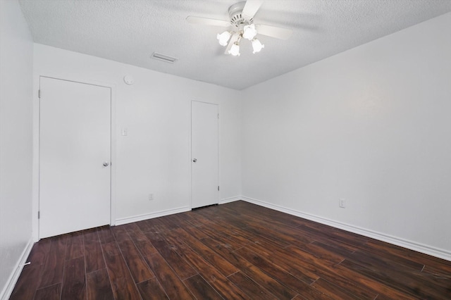 1713 Arvada Dr, Richardson, TX 75081 - unfurnished bedroom with wood finished floors, ceiling fan, a textured ceiling, and baseboards