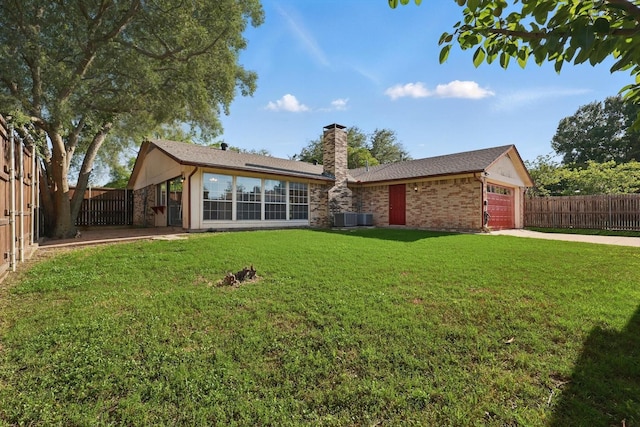 1713 Arvada Dr, Richardson, TX 75081 - single story home with a chimney, an attached garage, central AC unit, driveway, and brick siding