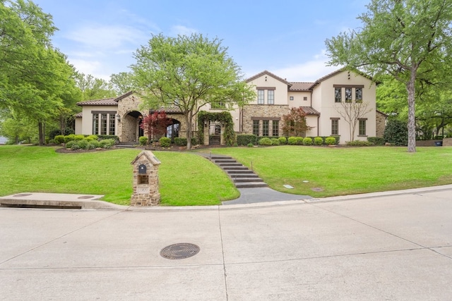 5909 Kittansett Ct, Fort Worth, TX 76132 - mediterranean / spanish home featuring a tiled roof, stone siding, and stucco siding