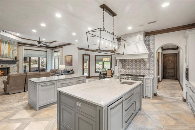 5909 Kittansett Ct, Fort Worth, TX 76132 - kitchen with a kitchen island with sink, gray cabinets, healthy amount of natural light, open floor plan, and recessed lighting