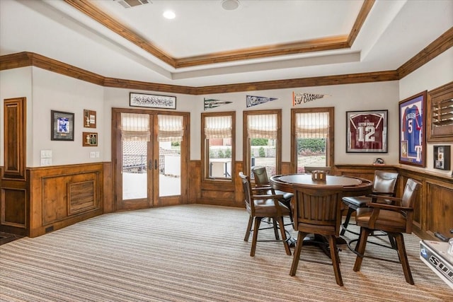 5909 Kittansett Ct, Fort Worth, TX 76132 - dining area with a wainscoted wall, french doors, ornamental molding, carpet, and a tray ceiling