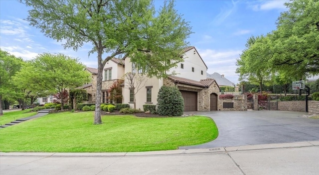 5909 Kittansett Ct, Fort Worth, TX 76132 - view of front of property featuring a tiled roof, stone siding, concrete driveway, stucco siding, and an attached garage