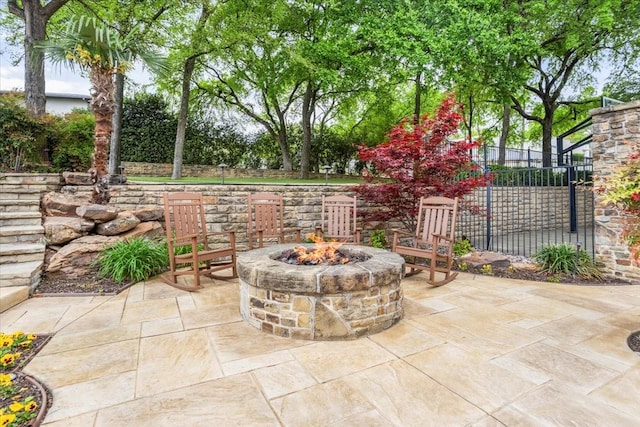 5909 Kittansett Ct, Fort Worth, TX 76132 - view of patio with an outdoor fire pit