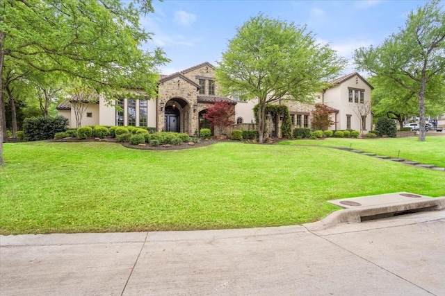5909 Kittansett Ct, Fort Worth, TX 76132 - view of front of home featuring stone siding, stucco siding, and a front lawn