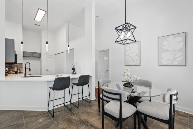 645 Spring Valley Rd, Allen, TX 75002 - dining space with a towering ceiling and baseboards
