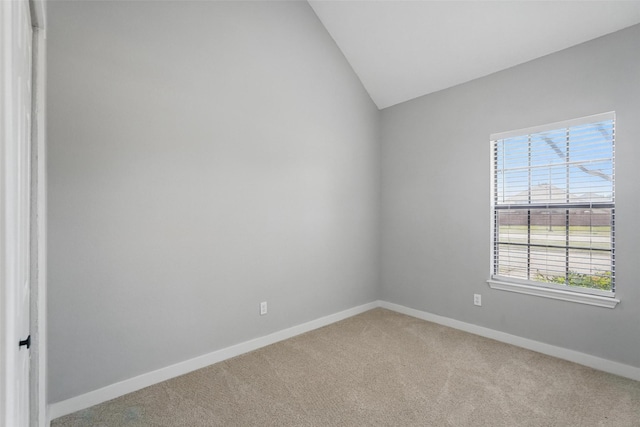645 Spring Valley Rd, Allen, TX 75002 - spare room featuring light colored carpet, lofted ceiling, and baseboards