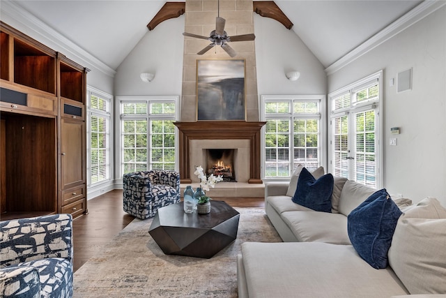 8722 Arbor Park Ct, Dallas, TX 75243 - living room with vaulted ceiling, wood finished floors, a premium fireplace, ceiling fan, and ornamental molding