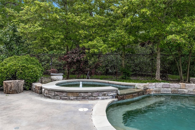 8722 Arbor Park Ct, Dallas, TX 75243 - view of swimming pool with a fenced backyard and a pool with connected hot tub