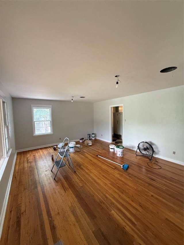 1405 S Hatcher St, Decatur, TX 76234 - unfurnished living room with hardwood / wood-style flooring and baseboards