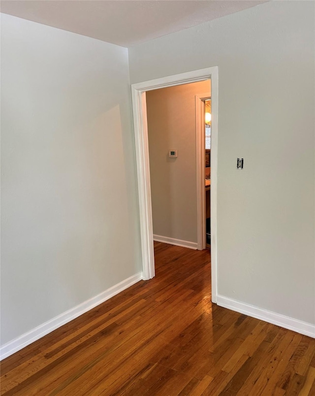 1405 S Hatcher St, Decatur, TX 76234 - empty room with wood finished floors and baseboards