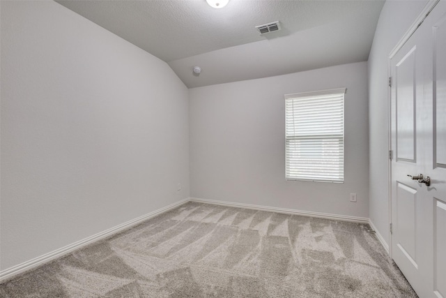 788 Cascade Ln, Princeton, TX 75407 - spare room featuring light colored carpet, baseboards, and vaulted ceiling