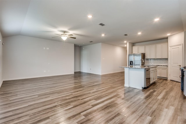788 Cascade Ln, Princeton, TX 75407 - kitchen with ceiling fan, appliances with stainless steel finishes, an island with sink, open floor plan, and recessed lighting
