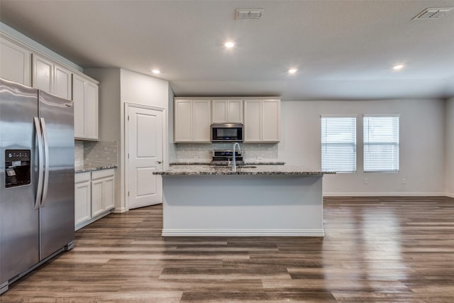 788 Cascade Ln, Princeton, TX 75407 - kitchen featuring appliances with stainless steel finishes, a sink, decorative backsplash, dark wood-type flooring, and recessed lighting