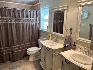 2319 N Wind Dr, Tool, TX 75143 - bathroom with two vanities, toilet, and a shower with curtain