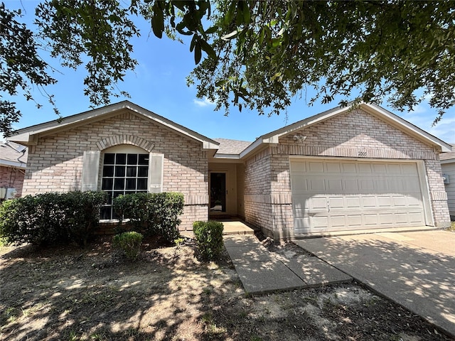 2005 Fairview Dr, Forney, TX 75126 - ranch-style house featuring brick siding, an attached garage, and concrete driveway
