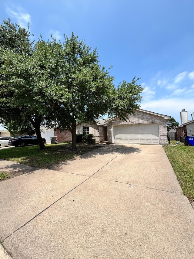 2005 Fairview Dr, Forney, TX 75126 - obstructed view of property with brick siding and concrete driveway