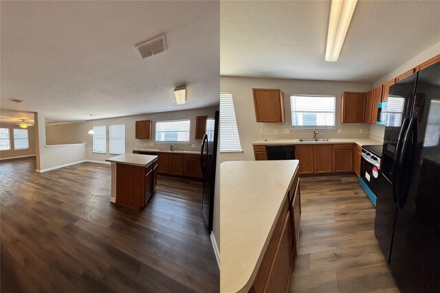 2005 Fairview Dr, Forney, TX 75126 - kitchen featuring a kitchen island, a sink, black appliances, dark wood-type flooring, and a ceiling fan