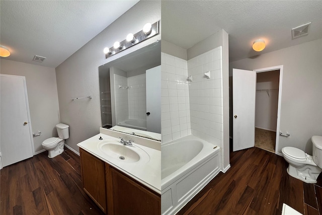 2005 Fairview Dr, Forney, TX 75126 - bathroom featuring toilet, wood finished floors, a textured ceiling, and shower / tub combination