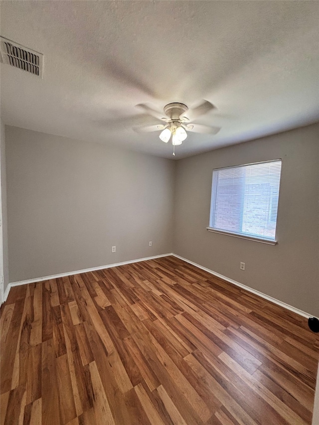 2005 Fairview Dr, Forney, TX 75126 - empty room with a ceiling fan, wood finished floors, and a textured ceiling