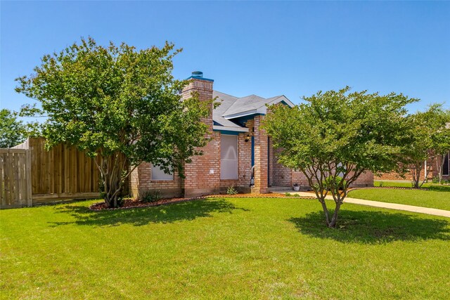 6923 Todd Ln, Sachse, TX 75048 - obstructed view of property featuring brick siding and a chimney