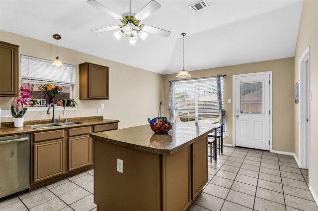 6923 Todd Ln, Sachse, TX 75048 - kitchen featuring a sink, stainless steel dishwasher, dark countertops, light tile patterned flooring, and ceiling fan