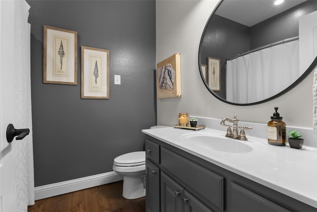 13625 Fishing Hole Ln, Fort Worth, TX 76052 - bathroom with vanity, toilet, wood finished floors, and baseboards