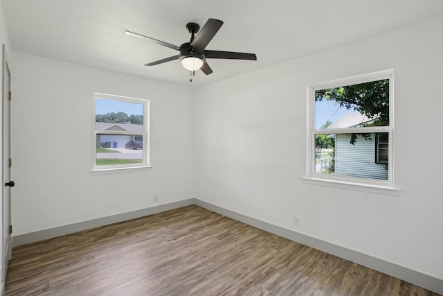 112 Gordon Dr, Azle, TX 76020 - empty room featuring wood finished floors, baseboards, and a ceiling fan