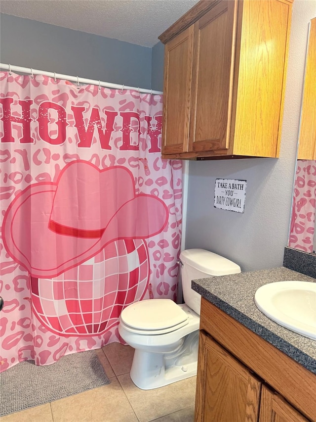 240 County Road 12550, Paris, TX 75462 - full bathroom featuring vanity, toilet, a textured ceiling, tile patterned floors, and curtained shower