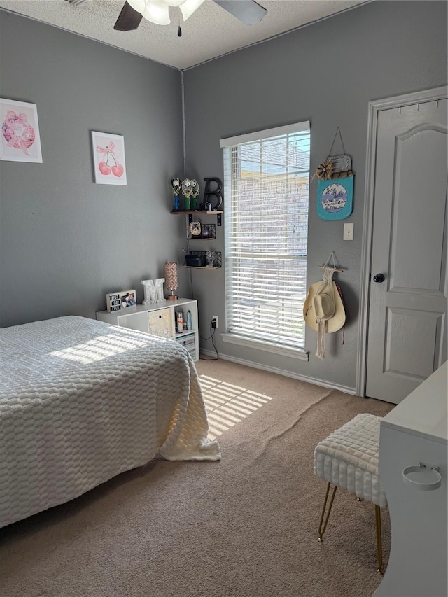 240 County Road 12550, Paris, TX 75462 - carpeted bedroom featuring multiple windows, ceiling fan, and baseboards