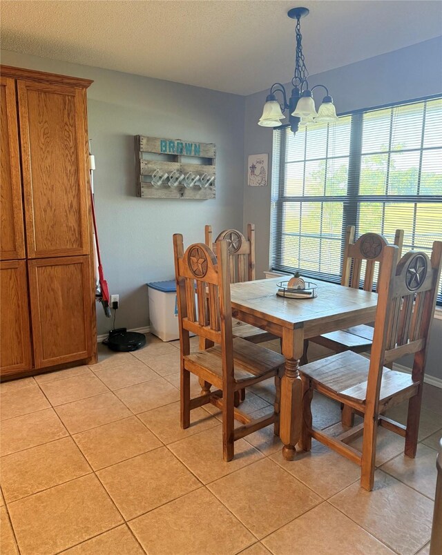 240 County Road 12550, Paris, TX 75462 - dining area with light tile patterned floors and a chandelier