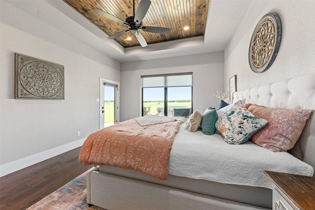 139 County Road 2525, Decatur, TX 76234 - bedroom featuring access to exterior, a raised ceiling, wood finished floors, baseboards, and a ceiling fan