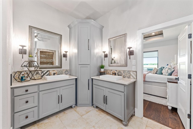 139 County Road 2525, Decatur, TX 76234 - full bathroom featuring decorative backsplash, two vanities, and ensuite bathroom