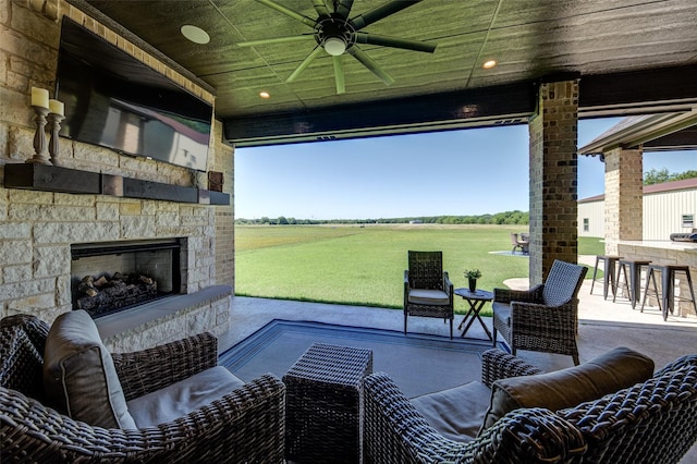 139 County Road 2525, Decatur, TX 76234 - view of patio / terrace featuring a ceiling fan and an outdoor living space with a fireplace