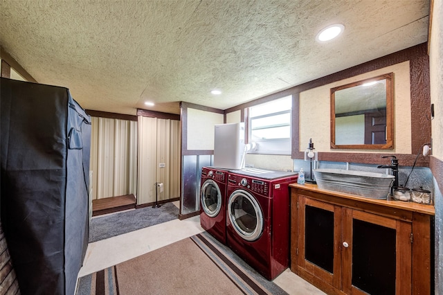 139 County Road 2525, Decatur, TX 76234 - laundry area featuring washer and dryer, a textured ceiling, recessed lighting, and light carpet
