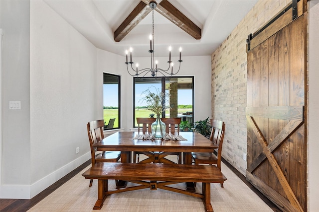139 County Road 2525, Decatur, TX 76234 - dining space with a barn door, a chandelier, beamed ceiling, baseboards, and wood finished floors