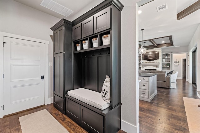 139 County Road 2525, Decatur, TX 76234 - mudroom with dark wood-type flooring, a fireplace, and baseboards