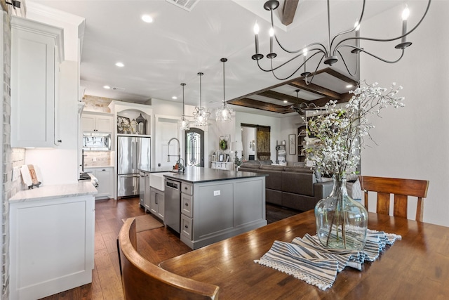 139 County Road 2525, Decatur, TX 76234 - kitchen with stainless steel appliances, recessed lighting, dark wood-type flooring, open shelves, and a center island with sink