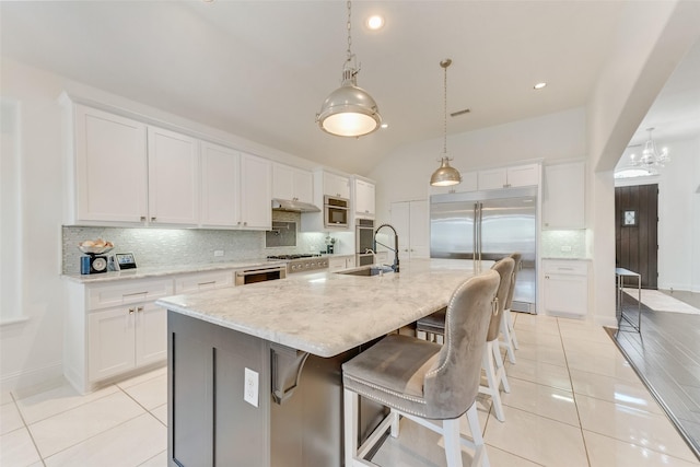 12748 Oakvale Trl, Fort Worth, TX 76244 - kitchen featuring stainless steel built in fridge, tasteful backsplash, light tile patterned floors, a sink, and vaulted ceiling