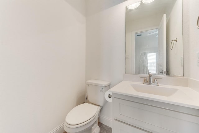12748 Oakvale Trl, Fort Worth, TX 76244 - bathroom featuring toilet, vanity, and baseboards