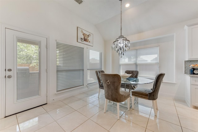 12748 Oakvale Trl, Fort Worth, TX 76244 - dining room with vaulted ceiling, a chandelier, light tile patterned floors, and baseboards