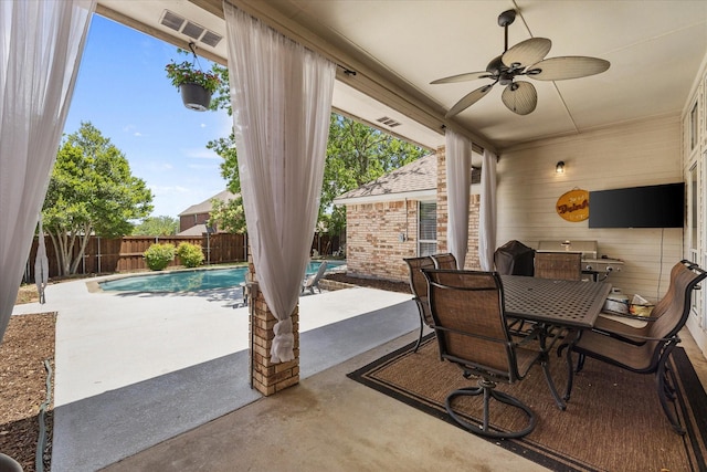 509 Windsor Way, Rockwall, TX 75087 - fenced backyard featuring a patio, ceiling fan, and outdoor dining area